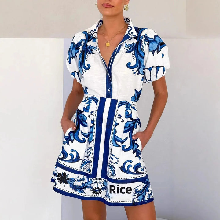 Elegant women's mini dress with floral print & puff sleeves. Great for cocktail events.