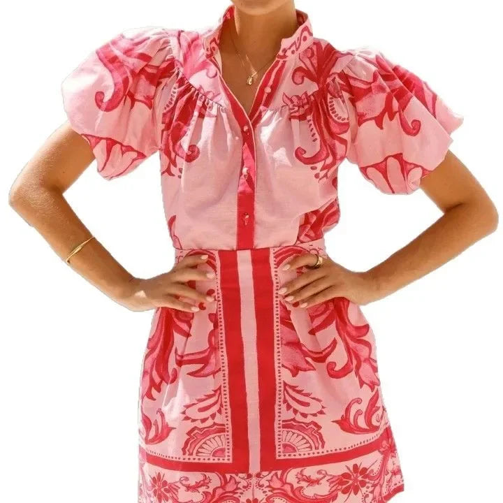 Summer style women's mini dress with vibrant floral print and elegant puff sleeves.