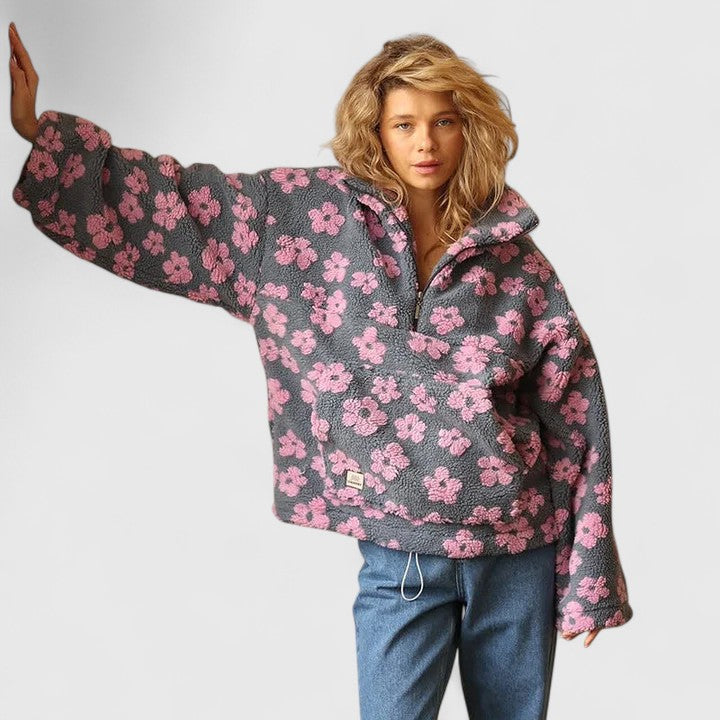 Stylish women's floral print quarter-zip pullover. Soft, cozy, and perfect for relaxed fall fashion.