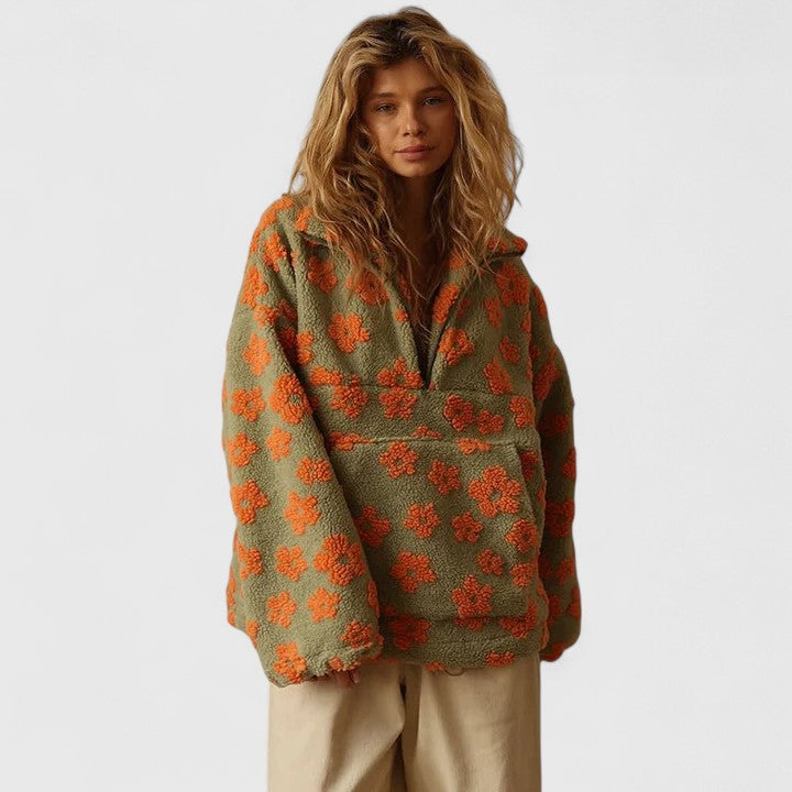 Woman wearing a cozy floral quarter-zip sweater, ideal for fall layering & winter warmth.