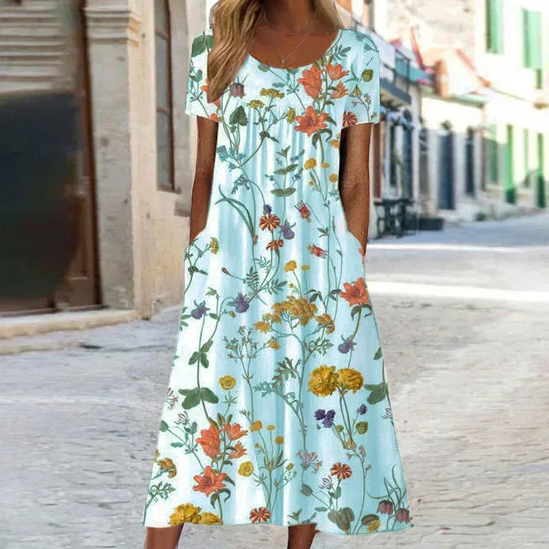 Relaxed fit women's floral midi sundress with short sleeves, comfortable for casual elegant day wear. Spring fashion.