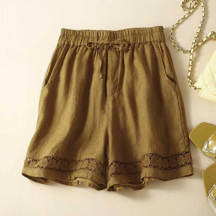 Pull-on women's floral shorts featuring a comfortable elastic waist for easy, relaxed summer style.