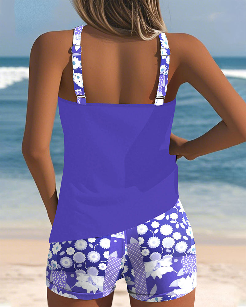Active women's floral tankini swimsuit set with shorts. Great two-piece for swimming, poolside, or beach fun.