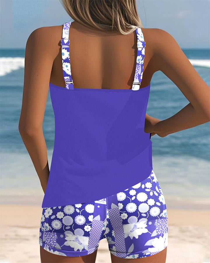 Active women's floral tankini swimsuit set with shorts. Great two-piece for swimming, poolside, or beach fun.