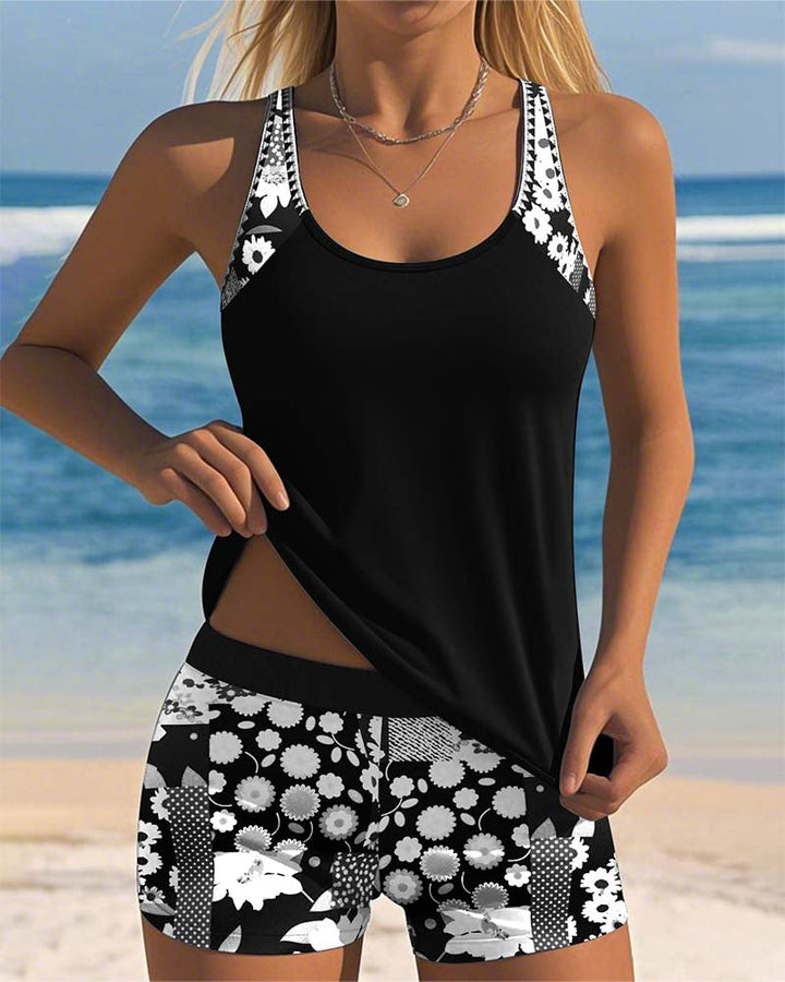 Vibrant floral print tankini swimsuit & shorts set for women. Trendy two-piece summer beachwear & vacation attire.