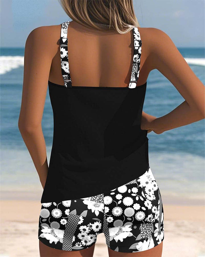 Complete women's floral tankini swimsuit set including comfortable swim shorts. Perfect two-piece for vacation.