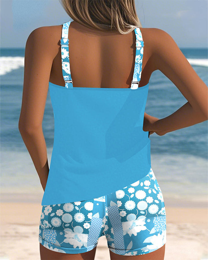 Summer-ready women's floral tankini swimsuit and shorts set. Perfect two-piece for beach trips or relaxing poolside.