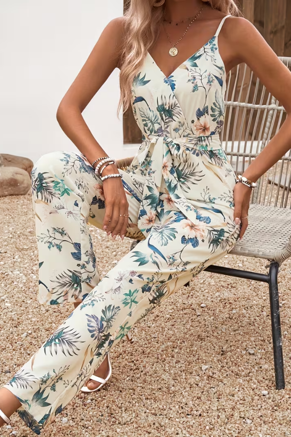 Stylish women's floral print cami jumpsuit with tie waist, ideal for spring & summer, warm weather fashion.