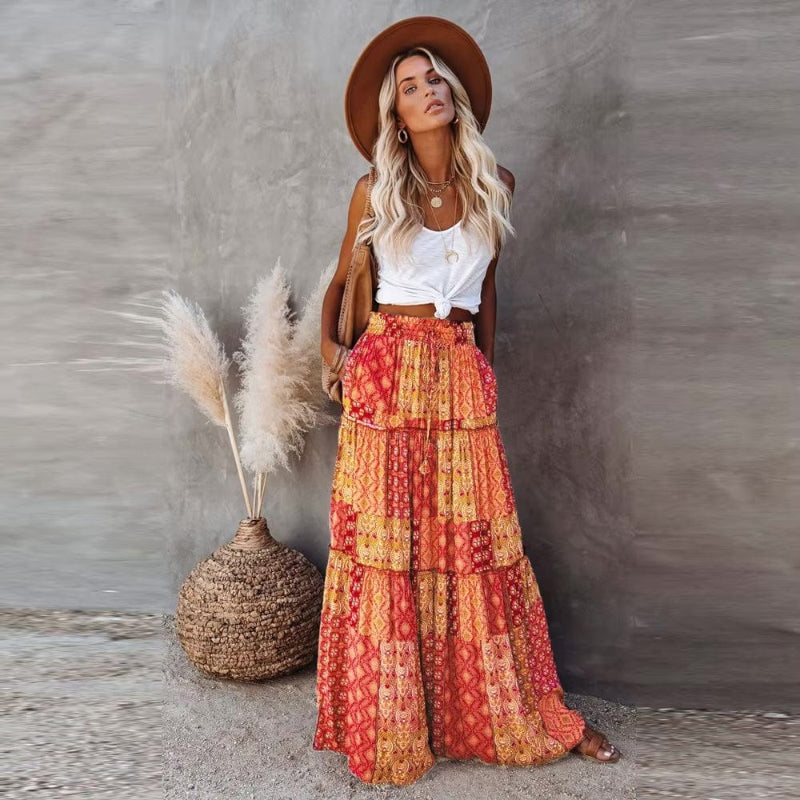 Women's floral tiered maxi skirt, high waist, flowy design for summer vacation & beachwear.