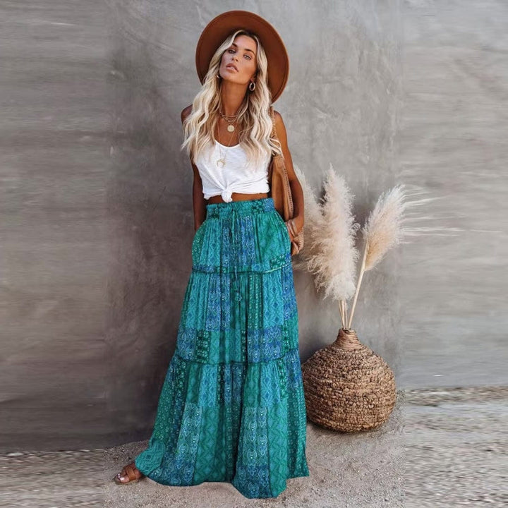 High-waisted women's floral tiered maxi skirt, featuring a breezy flow & vibrant print for summer style.