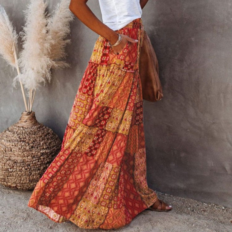 Stylish women's summer floral tiered maxi skirt, ideal for beach days or a bohemian vacation look.