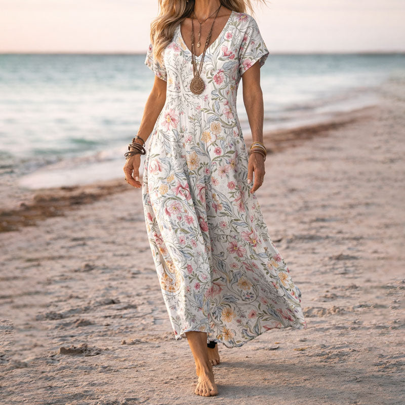 Women's floral V-neck boho maxi dress, perfect for summer beachwear. Flowy, comfortable long dress.