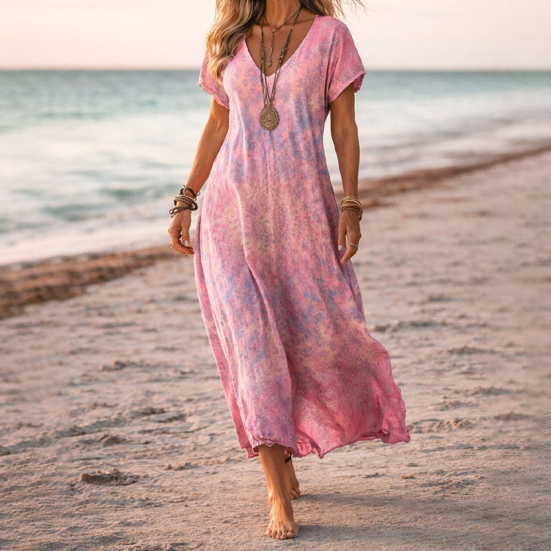 Bohemian floral print flowy maxi dress with a V-neck, ideal for casual summer fashion.