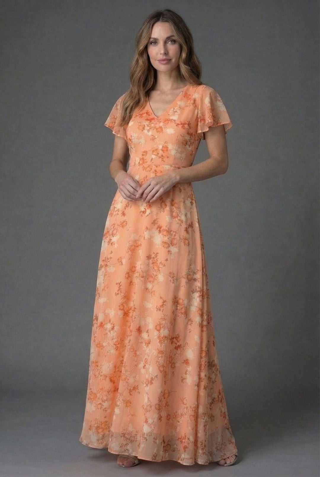 Women's floral V-neck maxi dress with flutter sleeves, perfect for spring/summer parties & wedding guests.