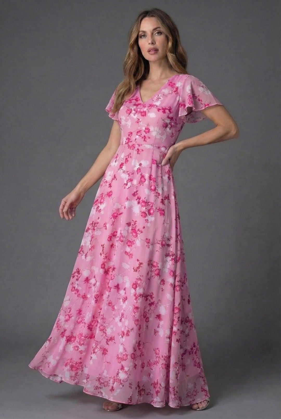 Chic women's V-neck maxi dress in a vibrant floral pattern, featuring elegant flutter sleeves. Great for special events.