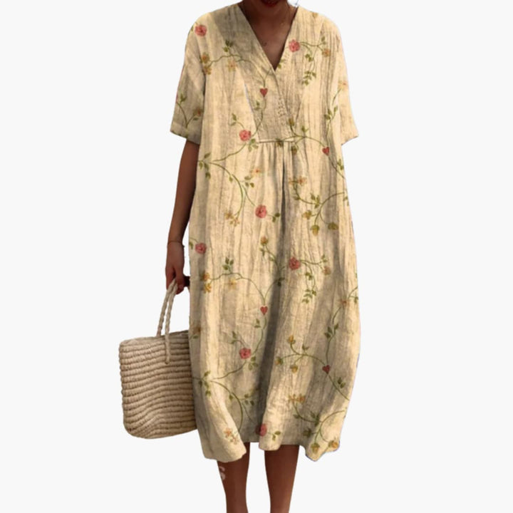 Close-up of the vibrant floral pattern on a women's V-neck short sleeve oversized midi casual dress.
