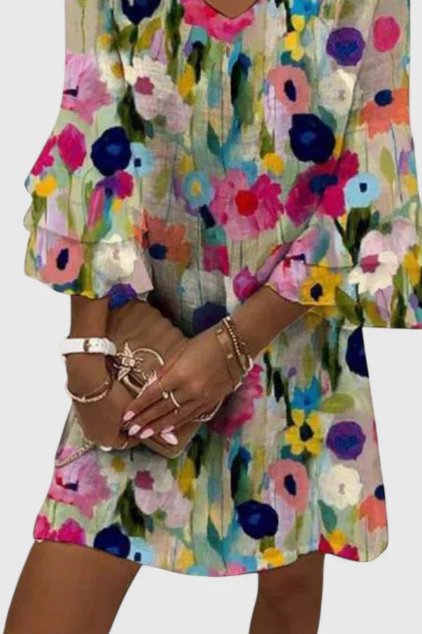 Effortless women's floral V-neck mini dress. Comfortable short summer dress, ideal for vacation wear & everyday style.