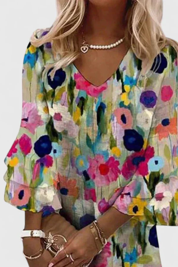 Chic women's floral mini dress featuring a V-neck & ruffled sleeves. Versatile for spring, summer, parties, or beach.