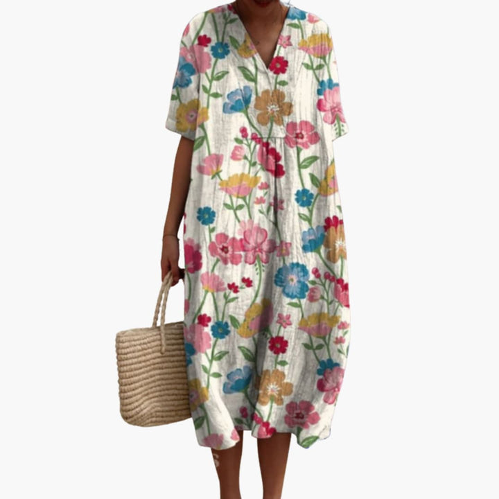 Women's floral V-neck oversized midi dress. Short sleeve, relaxed fit, perfect for summer casual wear.