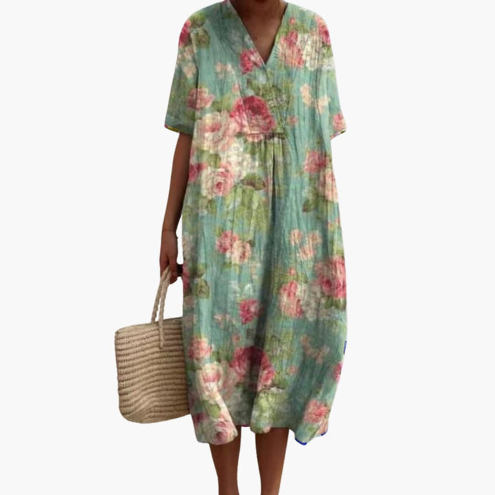 Elegant women's floral V-neck oversized midi dress. Short sleeve, comfortable for various occasions.