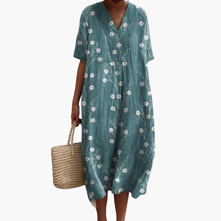 Bohemian-inspired floral V-neck oversized midi dress. Women's relaxed fit, perfect for summer outings.