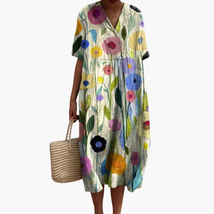 Comfortable women's floral V-neck midi dress. Oversized for a relaxed fit, ideal casual summer fashion.
