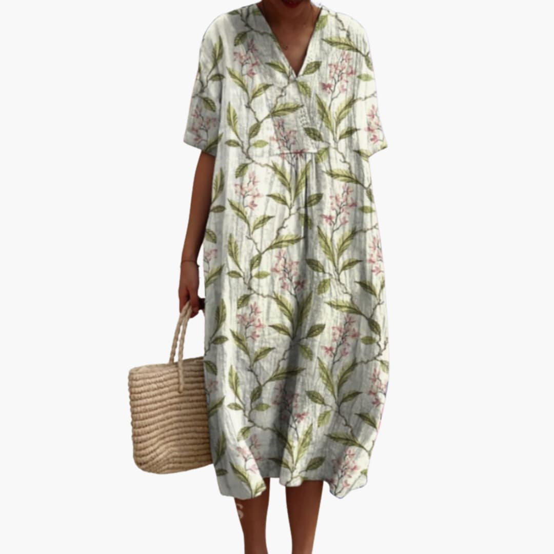 Chic women's floral print V-neck midi dress. Oversized, short sleeve, perfect for vacation or everyday.