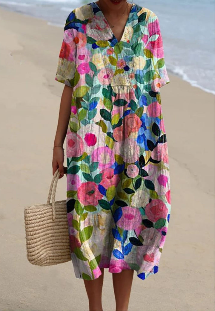 Women's floral V-neck short sleeve oversized midi dress, perfect for casual summer wear or vacation. Flowy, comfortable style.