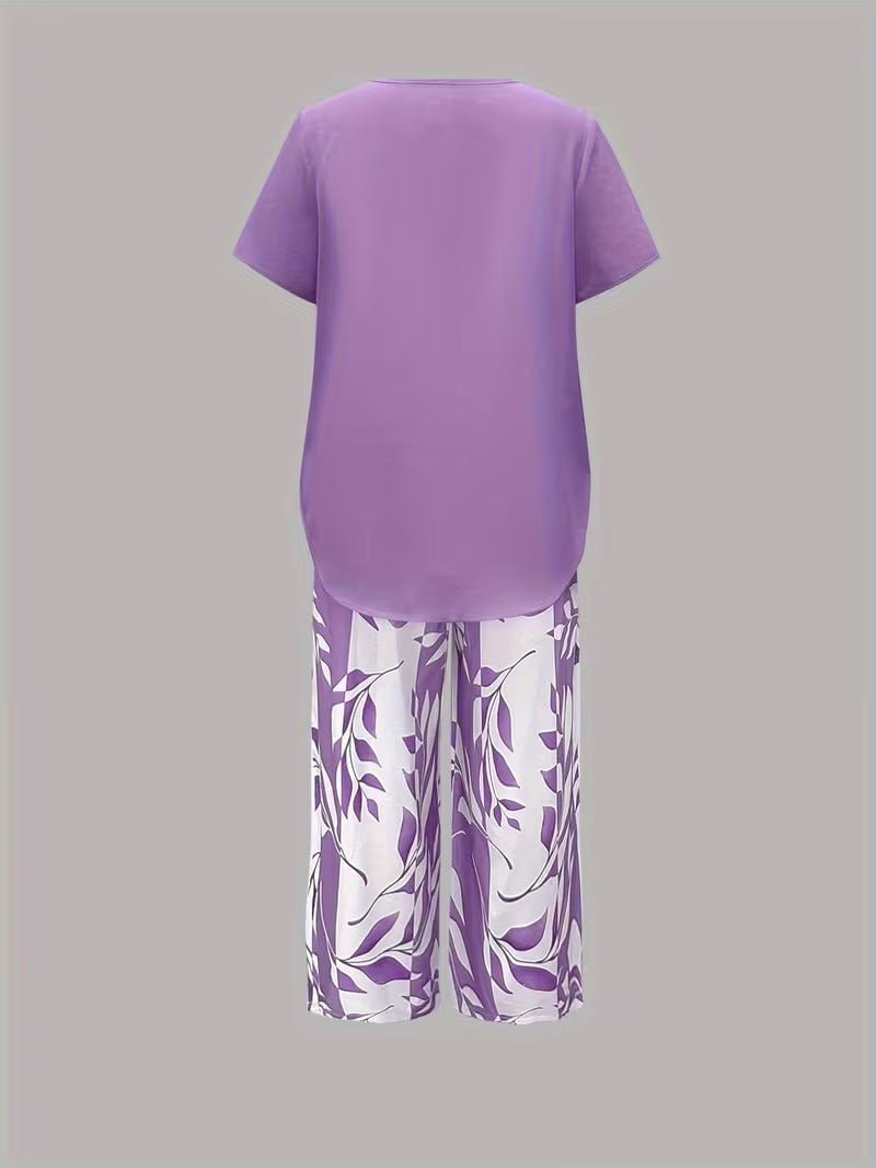Versatile women's floral V-neck top & wide-leg pant two-piece set. Ideal for casual outings or vacation wear.