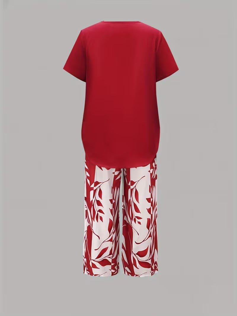 Full view of women's floral V-neck short-sleeve top and matching wide-leg pants, a chic casual two-piece set.