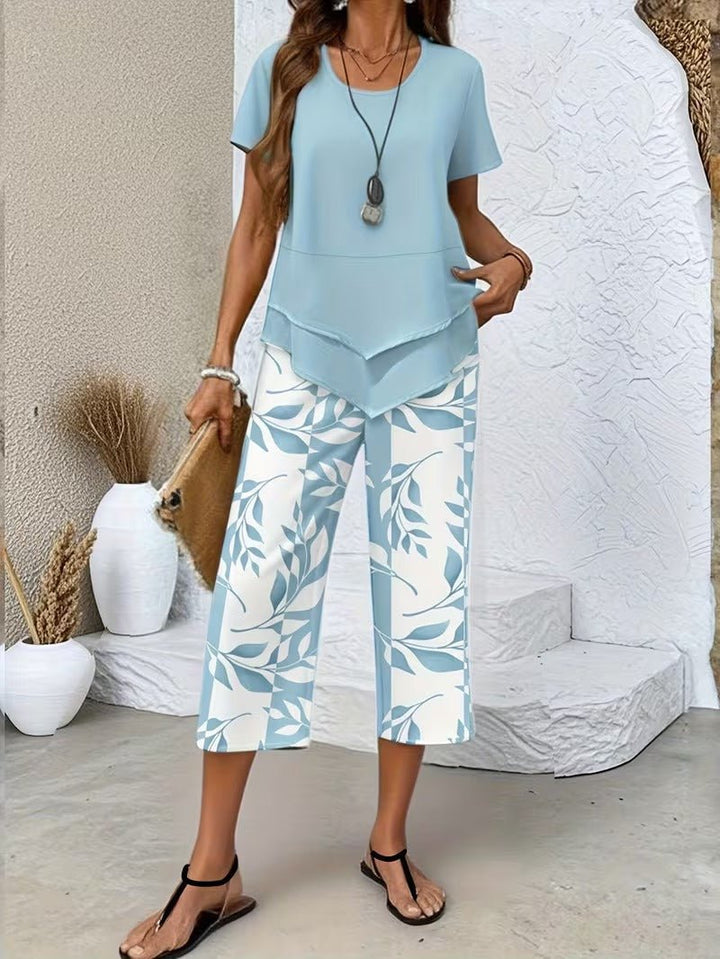 Relaxed fit women's floral short-sleeve V-neck top with matching wide-leg pants. Perfect lounge wear set.
