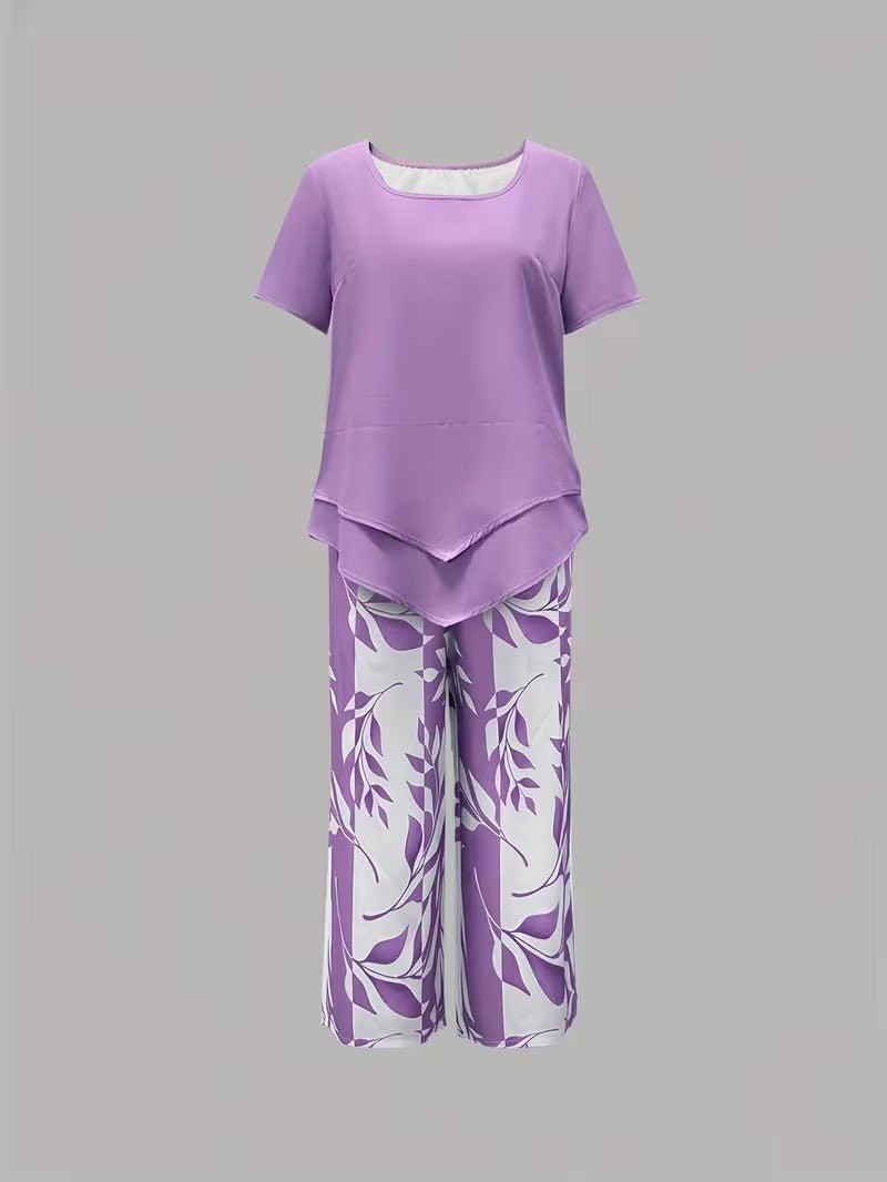 Vibrant floral print women's V-neck top & wide-leg pant set. Chic two-piece casual clothing for summer.