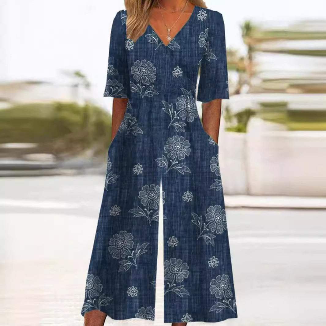 Bohemian women's floral jumpsuit, wide leg palazzo pants, V-neck, elbow sleeves for chic comfort.