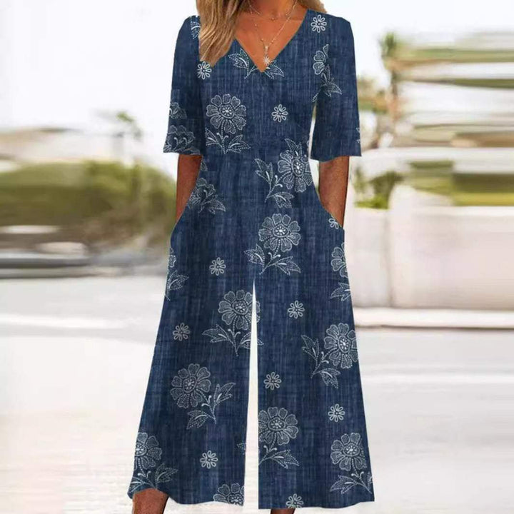 Bohemian women's floral jumpsuit, wide leg palazzo pants, V-neck, elbow sleeves for chic comfort.