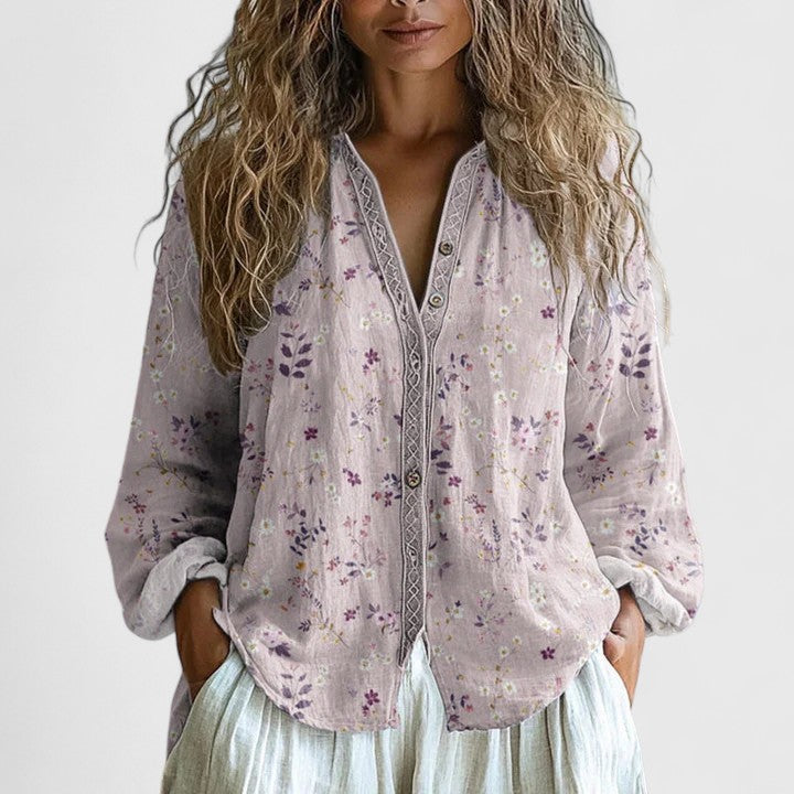 Stylish purple floral long sleeve top for women, featuring a chic zip-front V-neck and relaxed fit.