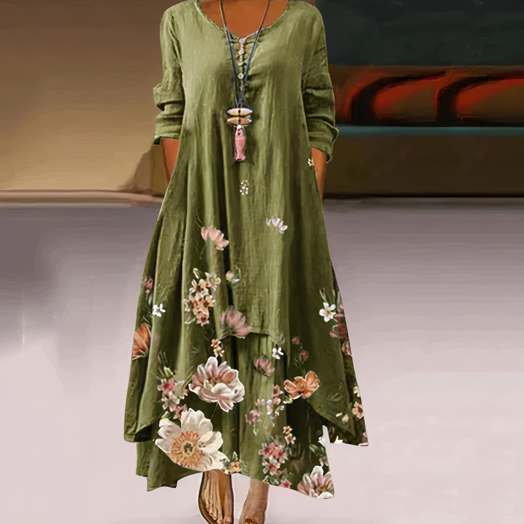 Elegant women's dress, long sleeves, midi length, vibrant print, and unique asymmetric hem.
