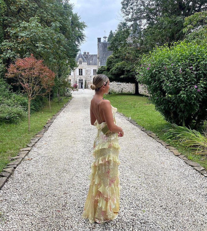 Stunning Women's Ruffle Maxi Dress with a chic open back. Perfect flowy evening gown for elegant events.