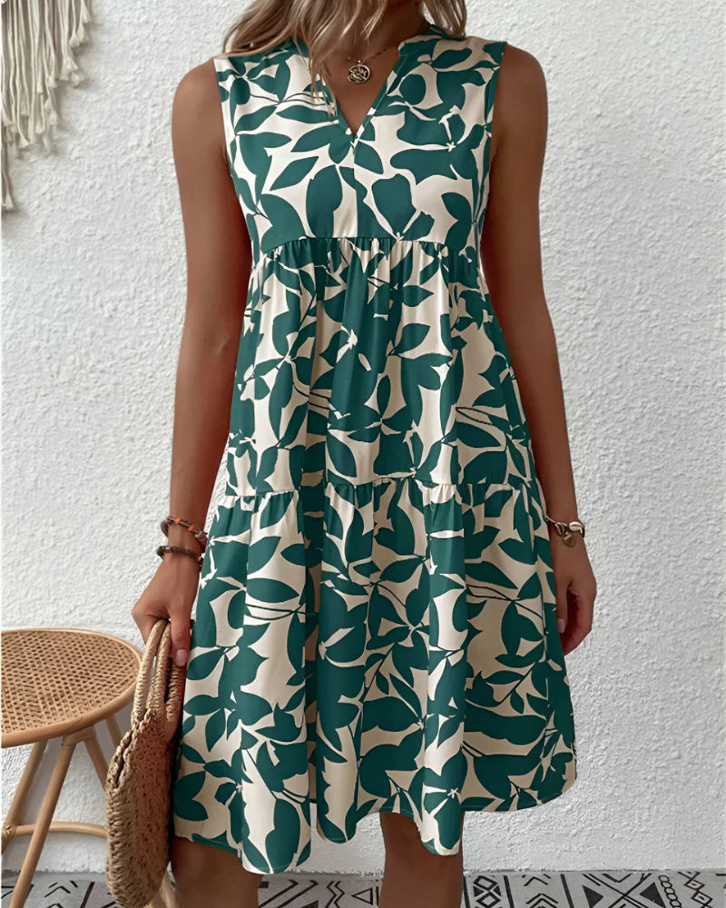 Women's flowing V-neck tiered midi dress, perfect for effortless summer style & comfort.