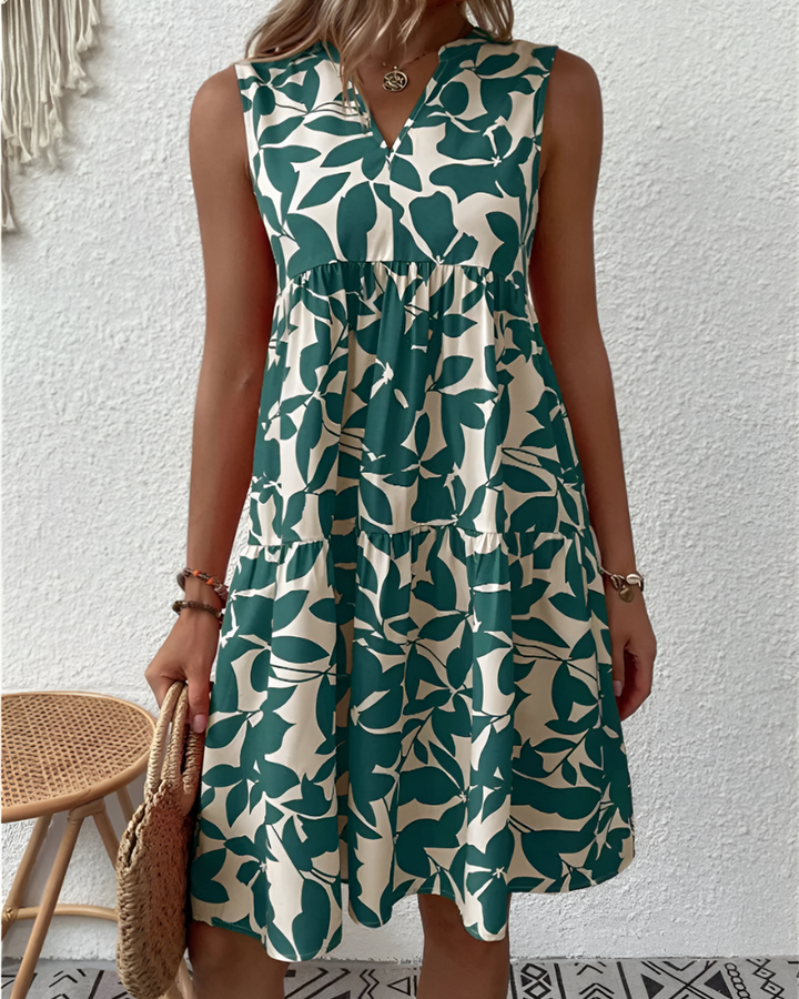 Women's flowing V-neck tiered midi dress, perfect for effortless summer style & comfort.