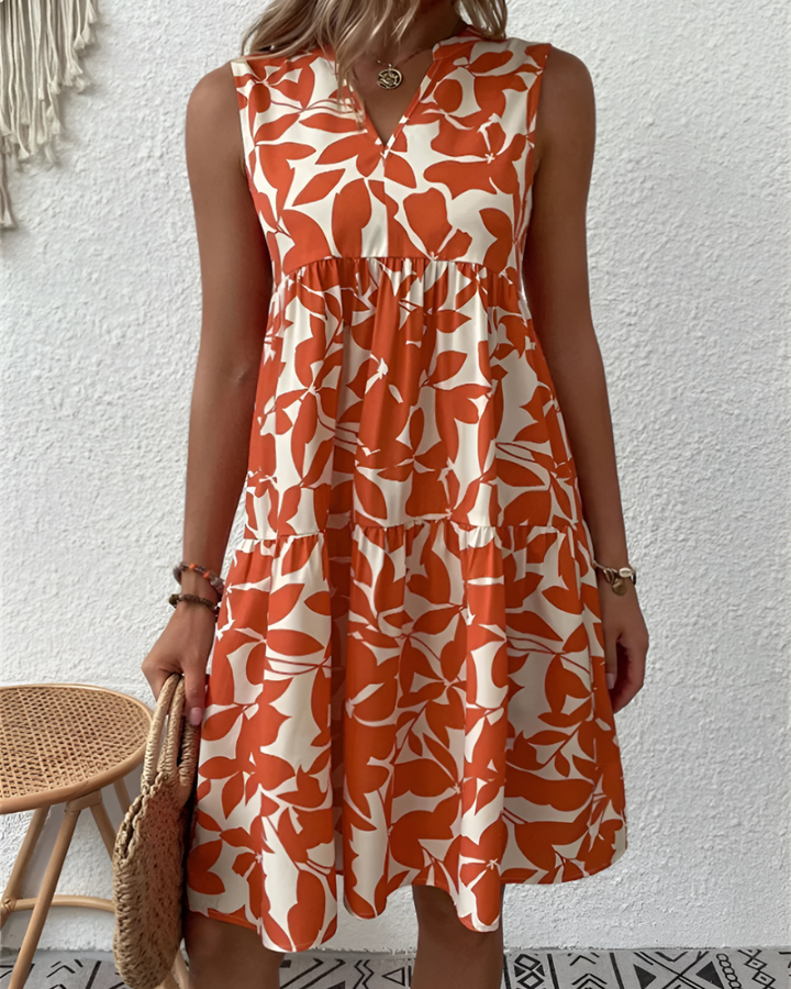 Flowy women's tiered midi dress with V-neck, ideal for summer vacations and effortless fashion.