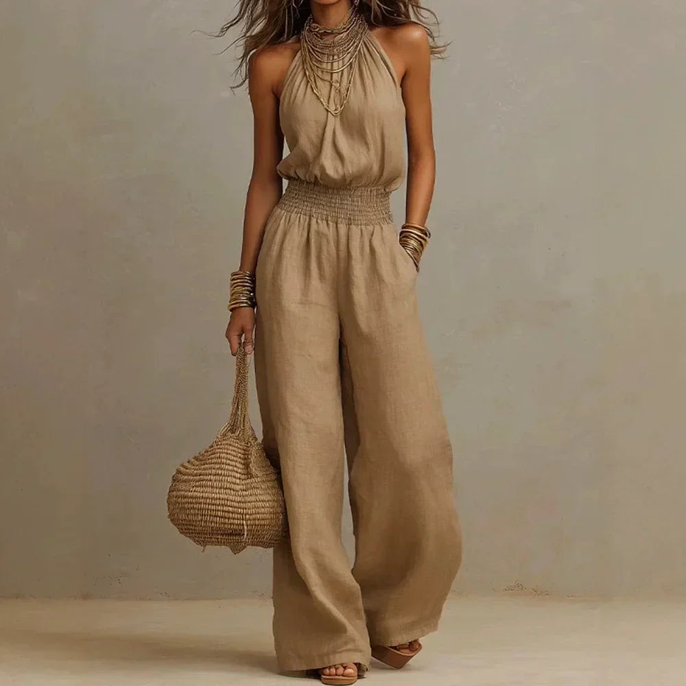 Women's flowing wide leg halter jumpsuit for summer casual or elegant vacation wear, comfortable & stylish.