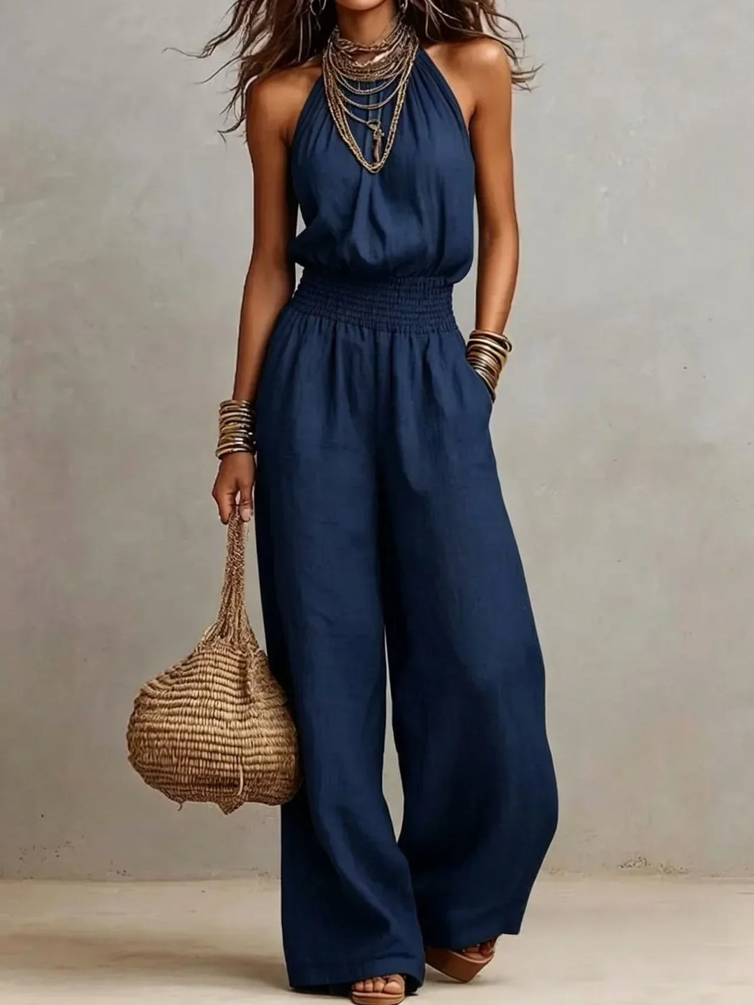 Comfortable women's halter wide leg jumpsuit with flowing fabric, a stylish and elegant choice for summer.