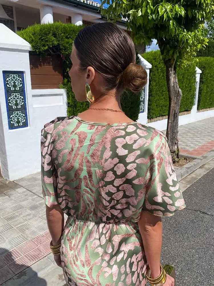 Relaxed fit women's flowy abstract print midi wrap dress with short sleeves, ideal for effortless summer style.