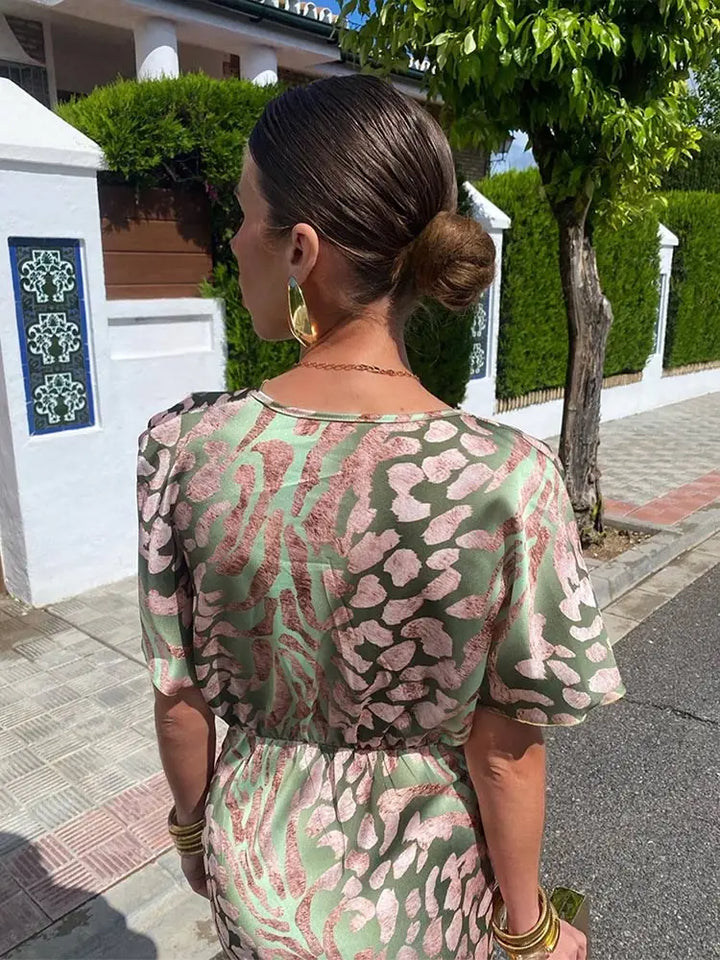Relaxed fit women's flowy abstract print midi wrap dress with short sleeves, ideal for effortless summer style.