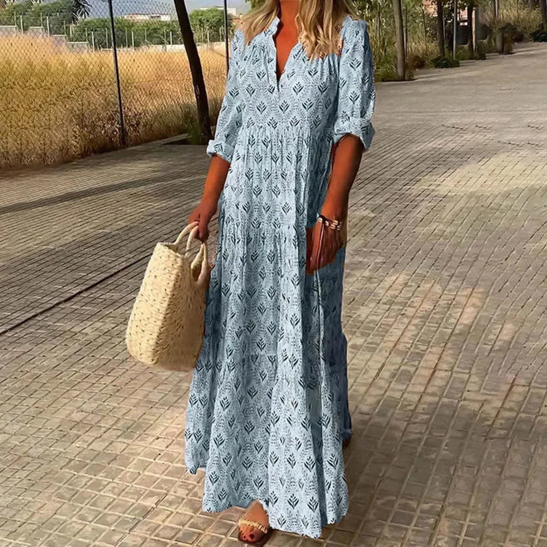Women's flowy bohemian V-neck maxi dress with long sleeves. Elegant & relaxed fit for summer, beach, or casual wear.