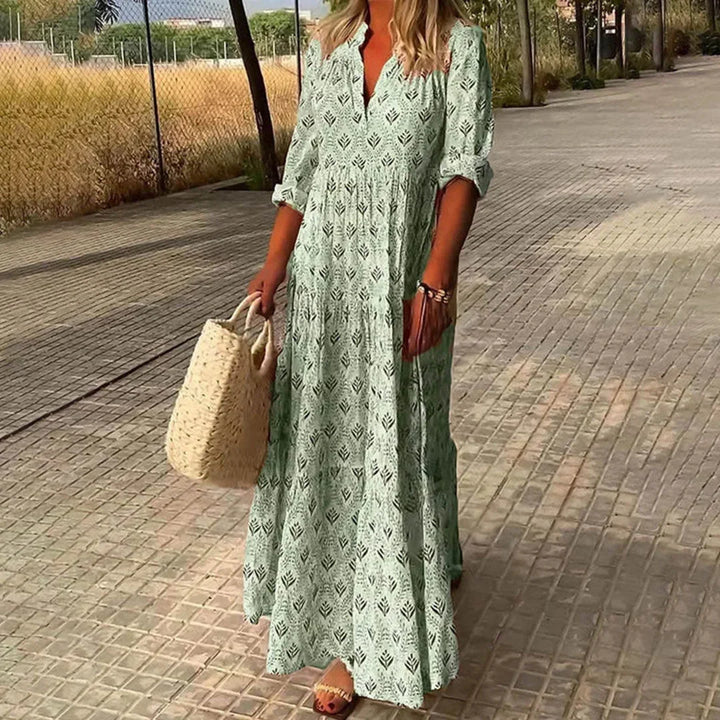 Women's elegant bohemian long sleeve maxi dress with V-neck. Ideal flowy summer dress for casual or beach fashion.