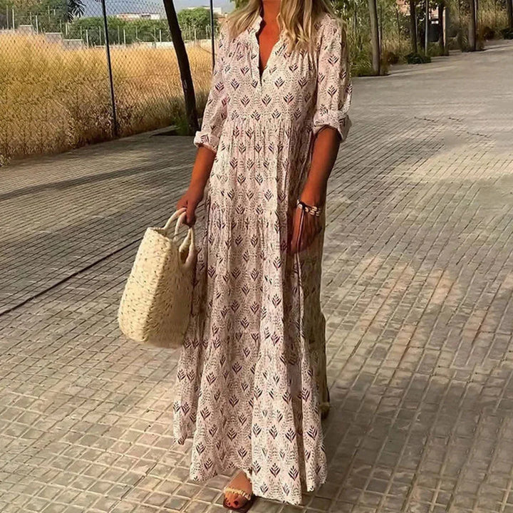 Comfortable women's boho V-neck maxi dress with long sleeves. A versatile flowy summer, beach, or casual garment.