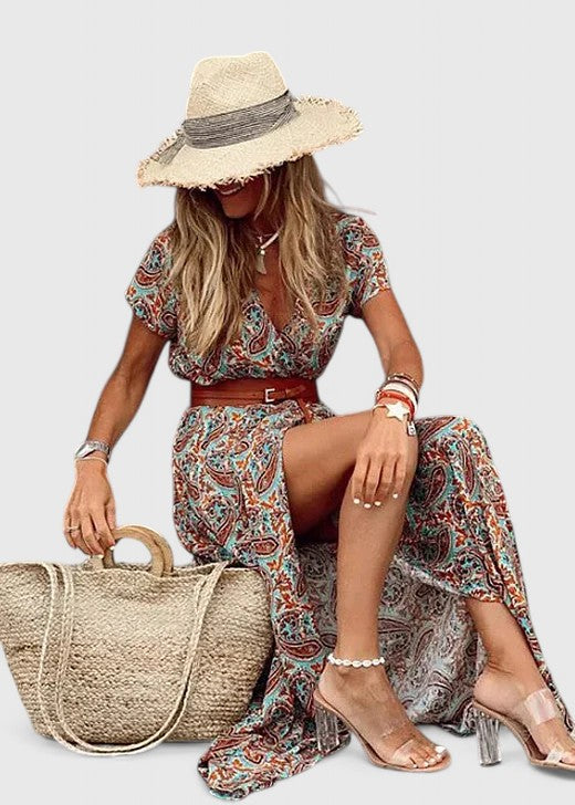 Woman walking in a flowy boho maxi dress, showcasing effortless movement. Perfect casual summer or vacation dress.