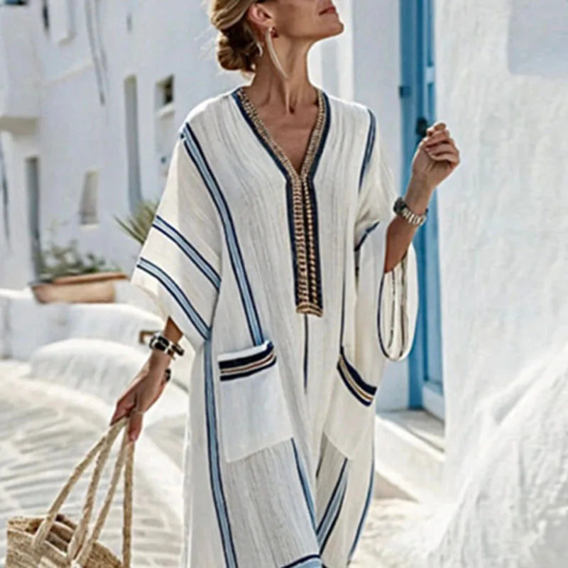 Elegant women's V-neck striped maxi dress, a long flowing boho style ideal for vacation, beach, or summer casual.