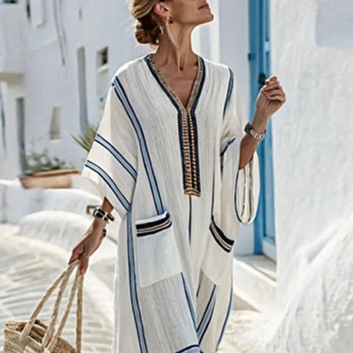 Elegant women's V-neck striped maxi dress, a long flowing boho style ideal for vacation, beach, or summer casual.